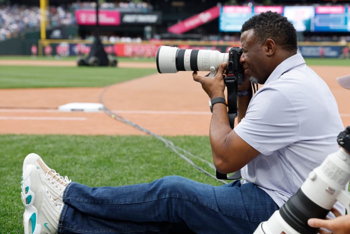Ken Griffey Jr. takes pictures during the 2023 All-Star Home Run Derby.